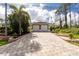 Attractive paver driveway leading to a two-car garage at 2629 Rolling Rd, North Port, FL 34288