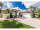 House exterior featuring a two-car garage and landscaping at 2629 Rolling Rd, North Port, FL 34288