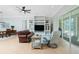 Gathering room boasts built-in shelving and leather seating at 2629 Rolling Rd, North Port, FL 34288