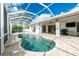 Enjoy this refreshing kidney-shaped pool with screened enclosure at 2629 Rolling Rd, North Port, FL 34288