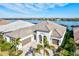 Luxury home with a lake view and three-car garage at 333 Bocelli Dr, Nokomis, FL 34275