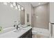 Clean bathroom with tub and dark vanity at 333 Bocelli Dr, Nokomis, FL 34275