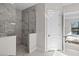 Large walk-in shower with marble tile and glass enclosure at 333 Bocelli Dr, Nokomis, FL 34275