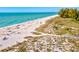 Scenic beach with people enjoying the sand and surf at 333 Bocelli Dr, Nokomis, FL 34275