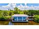 Private boat dock with covered area, perfect for enjoying water activities at 333 Bocelli Dr, Nokomis, FL 34275