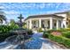 Elegant fountain and walkway leading to a community clubhouse at 333 Bocelli Dr, Nokomis, FL 34275