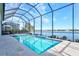 Enclosed pool and spa area with lake view at 333 Bocelli Dr, Nokomis, FL 34275