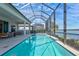 Enclosed rectangular pool with lake view at 333 Bocelli Dr, Nokomis, FL 34275