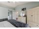 Spacious bedroom with ensuite bathroom access and large dresser at 4135 Dover E Dr, Bradenton, FL 34203