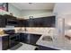 Well-equipped kitchen featuring dark wood cabinets at 4135 Dover E Dr, Bradenton, FL 34203