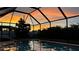 Enjoy beautiful sunsets from this screened-in pool area at 4135 Dover E Dr, Bradenton, FL 34203