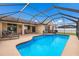 Large screened-in pool with patio furniture and plenty of sun at 4135 Dover E Dr, Bradenton, FL 34203