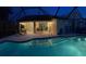 Relaxing pool and patio area illuminated for nighttime enjoyment at 4135 Dover E Dr, Bradenton, FL 34203