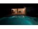 Relaxing pool and patio area illuminated for nighttime enjoyment at 4135 Dover E Dr, Bradenton, FL 34203