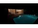 Relaxing pool and patio area illuminated for nighttime enjoyment at 4135 Dover E Dr, Bradenton, FL 34203