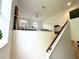 Carpeted staircase leading to a cozy loft area with a view of an upper-level bedroom at 5132 36Th W St, Bradenton, FL 34210