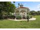 White gazebo with benches, offering a peaceful shaded area at 980 Cooper St # 302, Venice, FL 34285