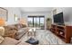 Bright living room with water views and comfy furniture at 1624 Stickney Point Rd # 401, Sarasota, FL 34231