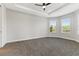 Spacious bedroom with carpeted floor and large windows at 3121 Tolmino Ct, Bradenton, FL 34211