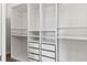 Large walk-in closet with ample shelving and drawers at 3121 Tolmino Ct, Bradenton, FL 34211