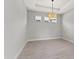 Bright dining room with tile floors and a modern chandelier at 3121 Tolmino Ct, Bradenton, FL 34211