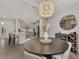 Elegant dining room with a round table and view of kitchen at 3121 Tolmino Ct, Bradenton, FL 34211