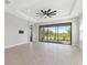 Spacious living room with tile floors and sliding glass doors leading to a patio at 3121 Tolmino Ct, Bradenton, FL 34211