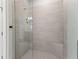 Large walk-in shower with glass enclosure and tiled walls at 3121 Tolmino Ct, Bradenton, FL 34211