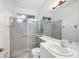 Clean bathroom featuring a shower, toilet, and vanity at 455 Park Trace Blvd, Osprey, FL 34229