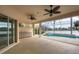 Covered patio with pool and lake views at 455 Park Trace Blvd, Osprey, FL 34229