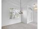 Formal dining room with arched window and chandelier at 455 Park Trace Blvd, Osprey, FL 34229