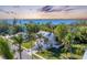 Two-story house with waterfront views, palm trees, and a sunset at 602 84Th Nw St, Bradenton, FL 34209