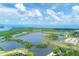 Aerial view of Robinson Preserve, showcasing a large lake and surrounding landscape at 602 84Th Nw St, Bradenton, FL 34209