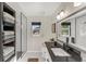 Modern bathroom with a walk-in shower and dark vanity at 602 84Th Nw St, Bradenton, FL 34209