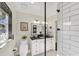 Modern bathroom with white cabinets and black countertops at 602 84Th Nw St, Bradenton, FL 34209