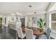 Bright dining room with an oval table and modern chandelier at 602 84Th Nw St, Bradenton, FL 34209