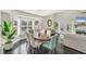 Elegant dining room with a dark wood table and teal chairs at 602 84Th Nw St, Bradenton, FL 34209