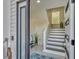 Bright entryway with modern staircase and tile flooring at 602 84Th Nw St, Bradenton, FL 34209