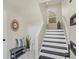 Modern entryway, featuring a staircase and stylish decor at 602 84Th Nw St, Bradenton, FL 34209