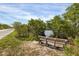 Resting bench near a calm waterway in Robinson Preserve at 602 84Th Nw St, Bradenton, FL 34209