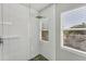 Bright shower with white tile and glass enclosure at 602 84Th Nw St, Bradenton, FL 34209