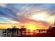 Stunning sunset over the water with boats on a dock at 602 84Th Nw St, Bradenton, FL 34209