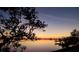 Scenic sunset view over calm water with a dock in the foreground at 602 84Th Nw St, Bradenton, FL 34209