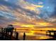 Idyllic sunset view of boats on a dock near the water at 602 84Th Nw St, Bradenton, FL 34209