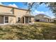 The backyard features a screened porch and a view to the adjacent home at 14847 Skip Jack Loop, Lakewood Ranch, FL 34202