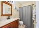 Bathroom featuring a wood vanity, neutral walls, and a shower with curtain at 14847 Skip Jack Loop, Lakewood Ranch, FL 34202