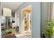 A bright entryway leading into a living room, with neutral walls and sunlight streaming through the front door at 14847 Skip Jack Loop, Lakewood Ranch, FL 34202