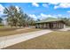 Park pavilion with picnic tables, benches, and a playground nearby, great for Gathering gatherings and activities at 14847 Skip Jack Loop, Lakewood Ranch, FL 34202