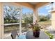 Cozy screened porch with view to the yard at 14847 Skip Jack Loop, Lakewood Ranch, FL 34202