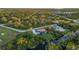 Aerial view of a house near a canal with green surroundings at 2129 Lorraine Dr, Port Charlotte, FL 33953